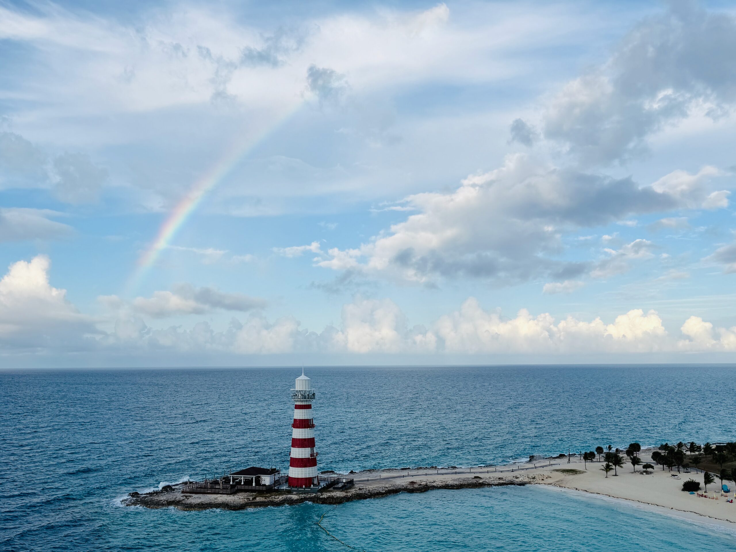 MSC World America Review: Why This Ship Exceeded My Expectations! Rainbow over Lighthouse on MSC Ocean Cay
