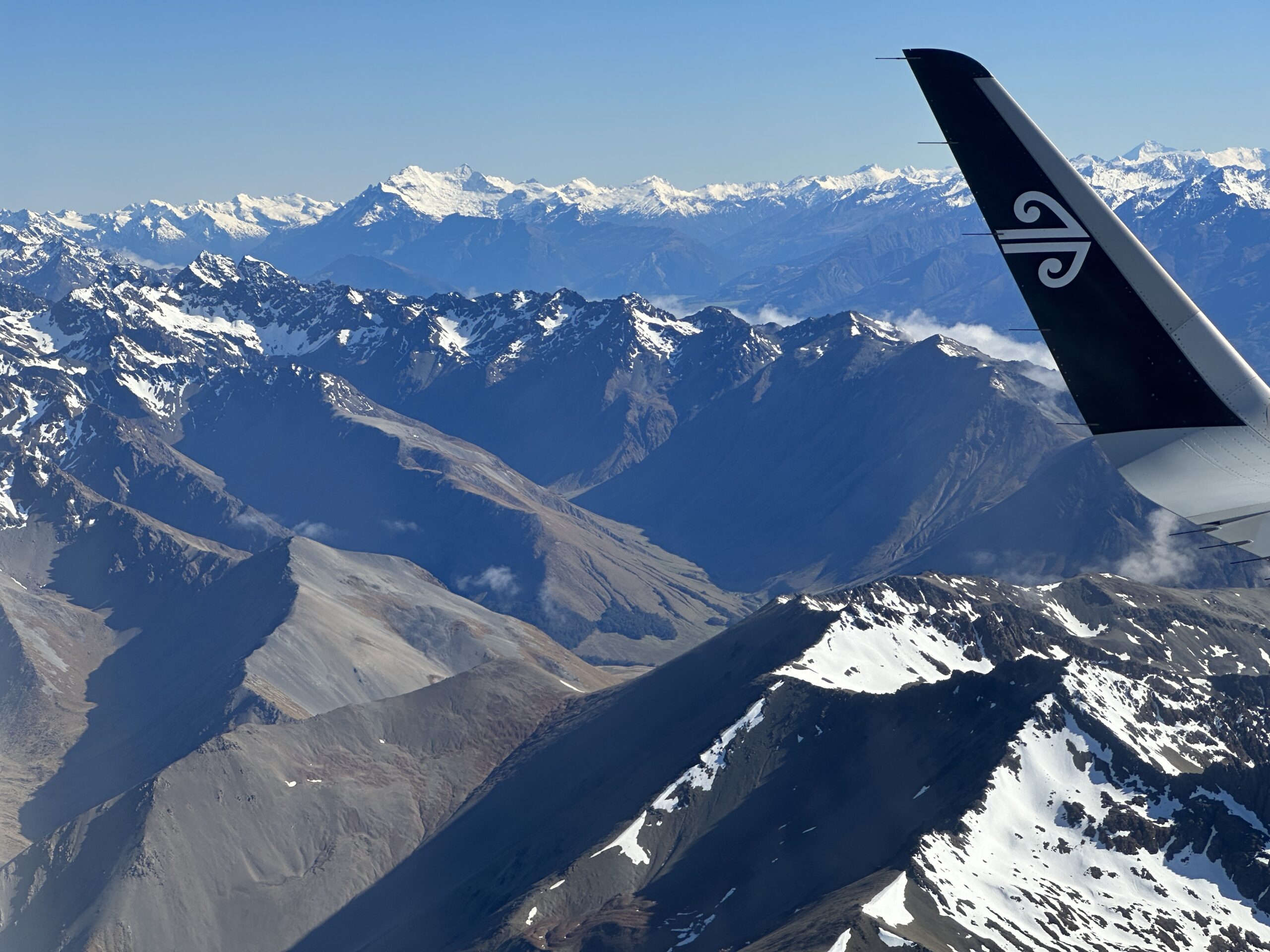 New Zealand, Queenstown, and One Perfect Moment in Milford Sound Flying over the Southern Alps